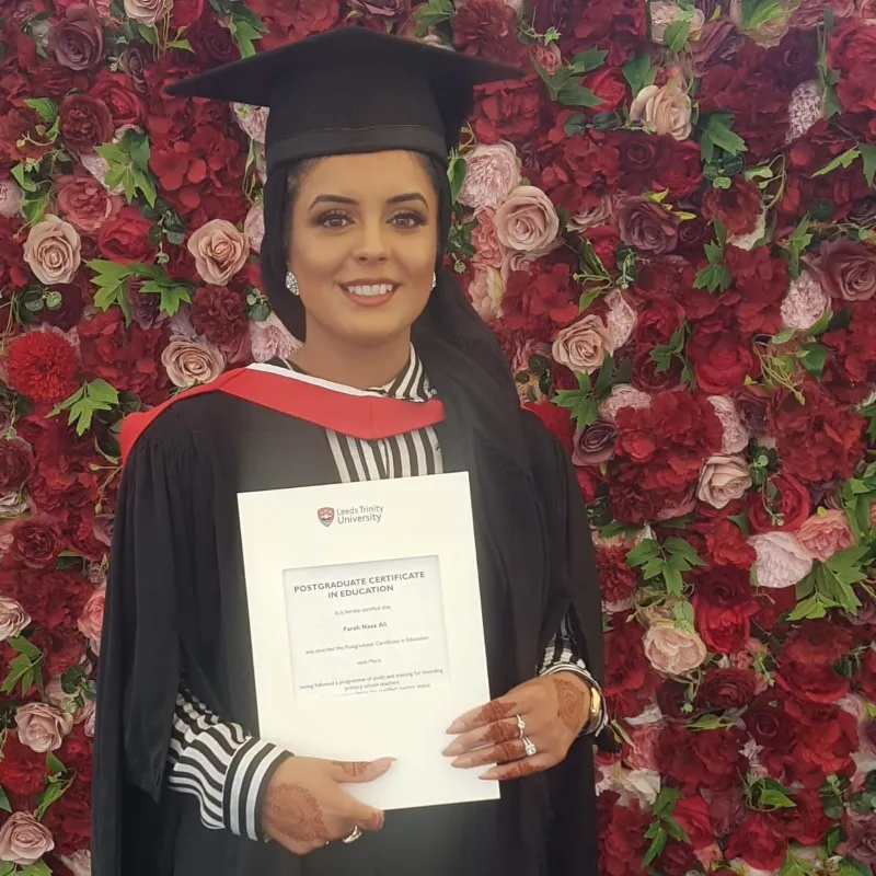 Farah Ali graduation with certificate.