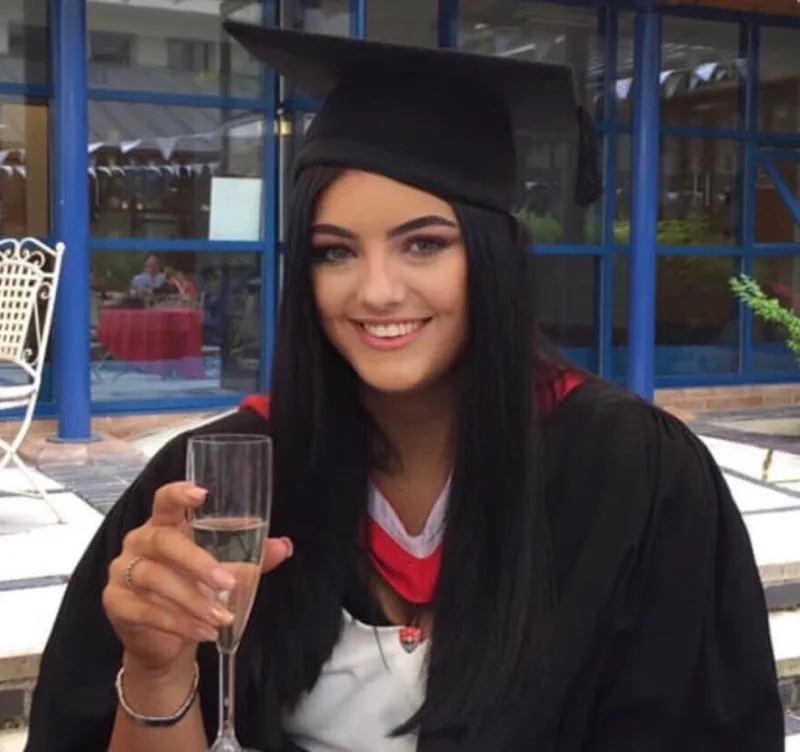 Sarah Baugh graduation with drink.