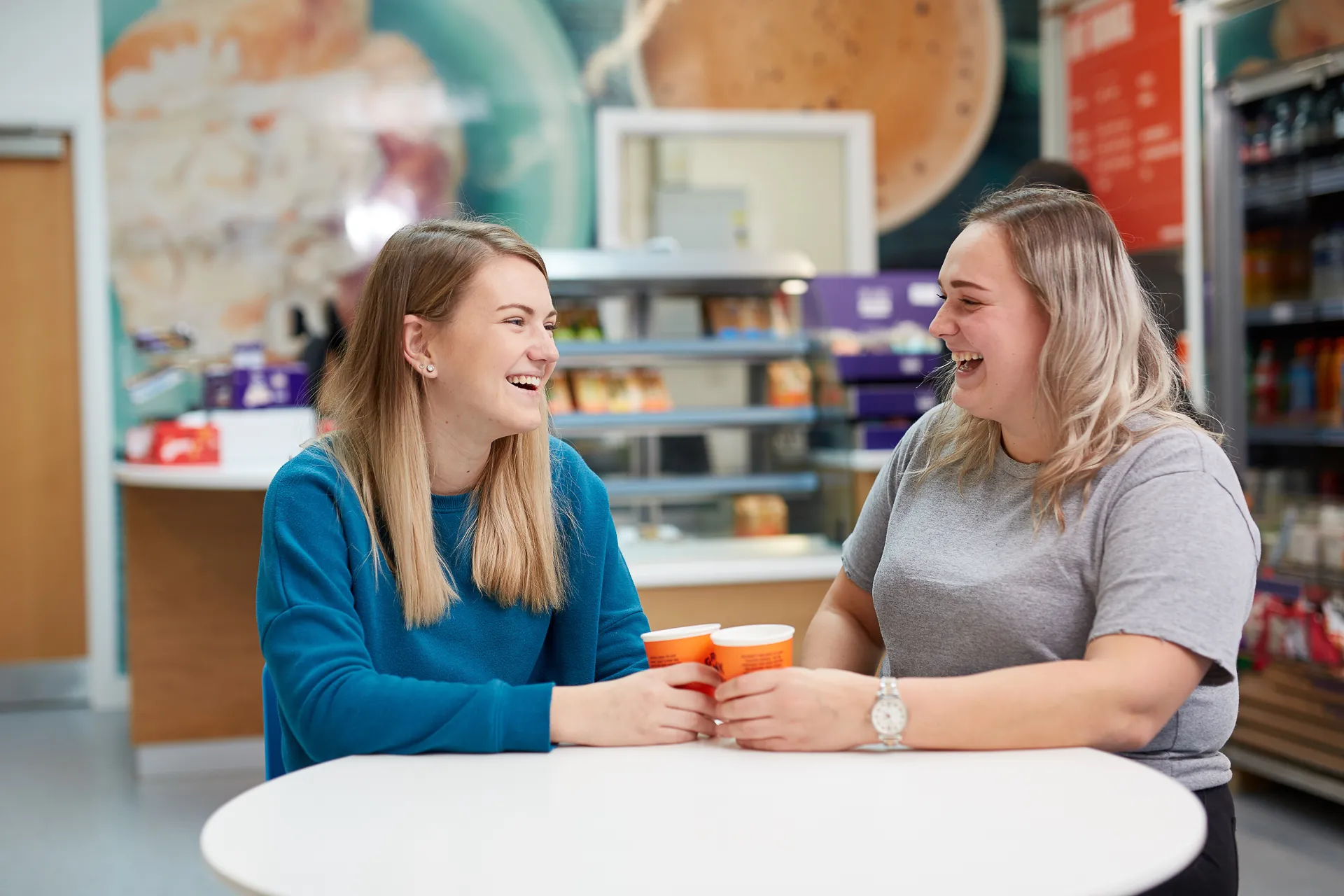 Peer Support Champions chatting in the Andrew Kean Learning Centre.