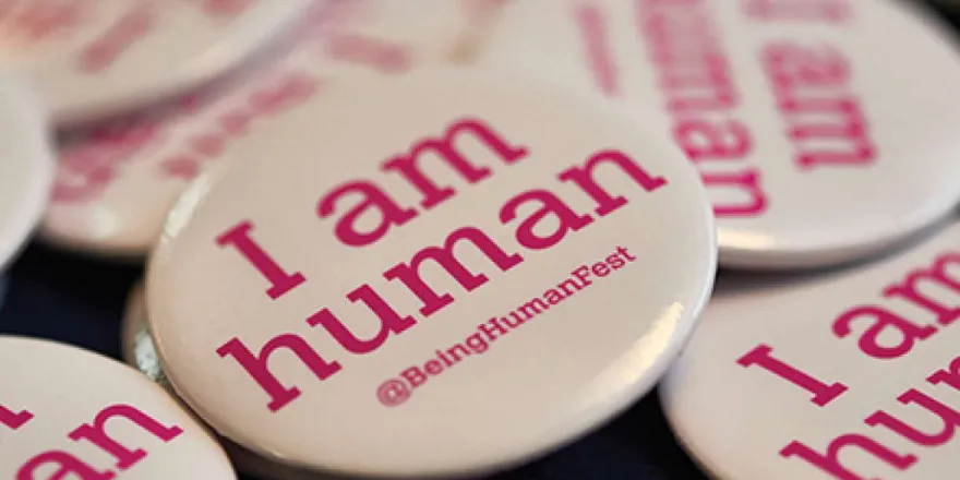 A badge with the words I am human.