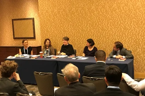 Professor Reverend Jane de Gay sits on a panel at the American Academy of Religion conference.