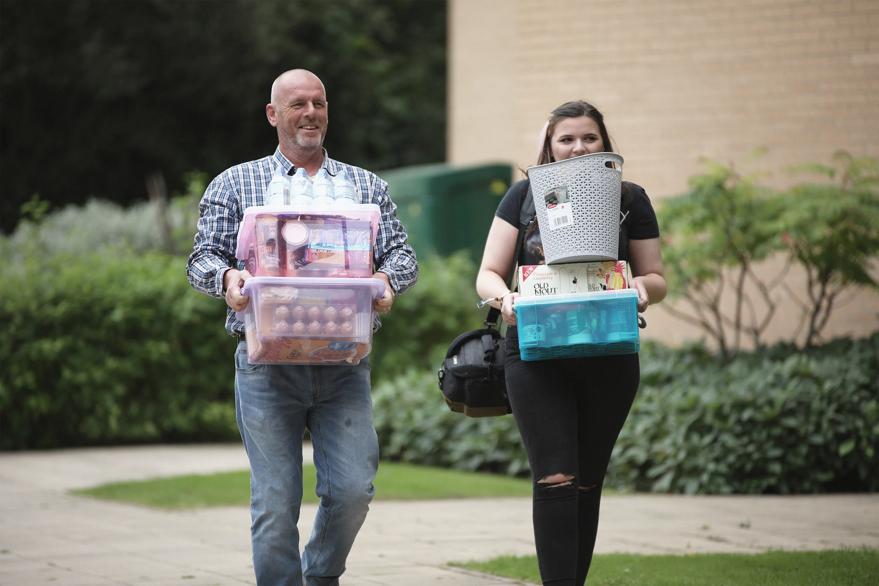 Parent/guardian helps new student move in to accommodation.